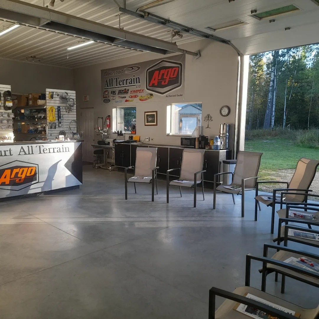 Shop classroom with chairs set and bay door open for operator training